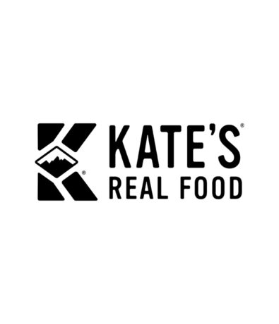 The Kate’s Real Food logo features a bold letter K with a mountain design inside, reminiscent of the Seattle Boulderfest competition, and the words KATE’S REAL FOOD in uppercase black letters on a white background.